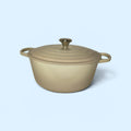 Random Finds Retail beige enameled cast iron round Dutch oven with lid and ergonomic side handles