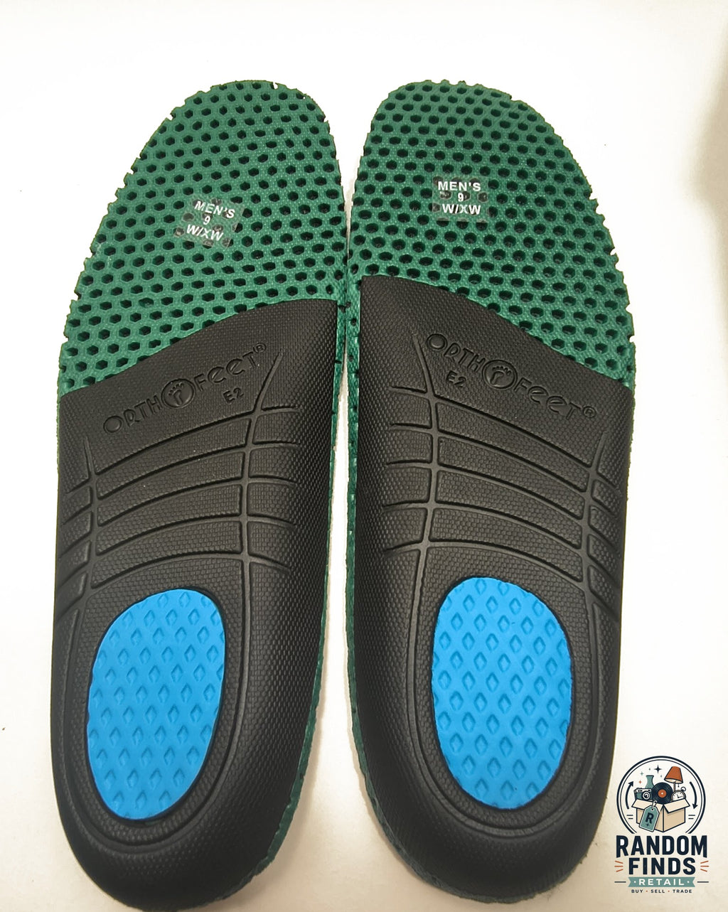 Random Finds Retail Orthofeet orthopedic insoles with green honeycomb arch support, black base, and blue heel cushion.