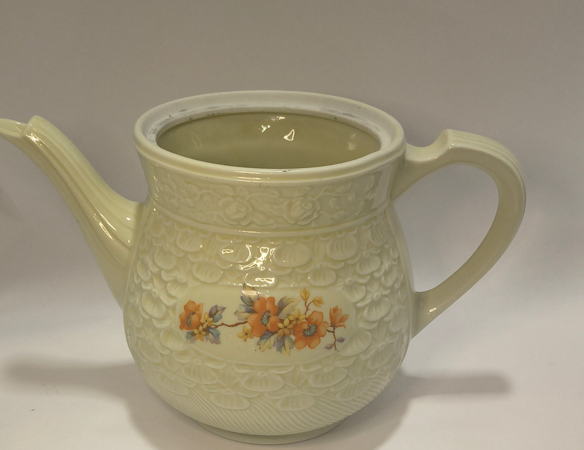 Vintage Floral Ceramic Teapot – Embossed Off-White Pottery with Orange Floral Detail